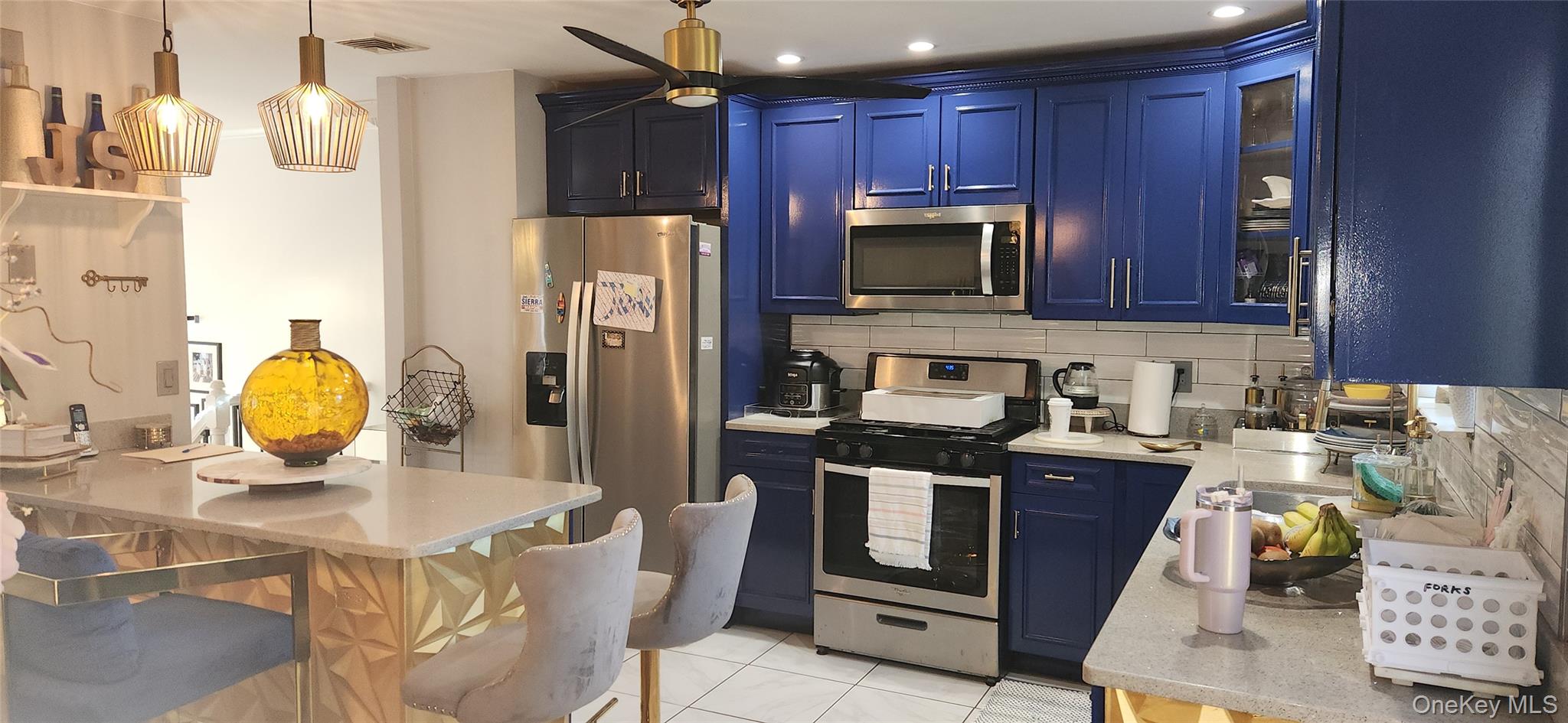 5 Magar Road Middletown, NY 10940 - Photo 6 of 31 a kitchen with stainless steel appliances granite countertop a stove a refrigerator a sink dishwasher a dining table and chairs with wooden floor