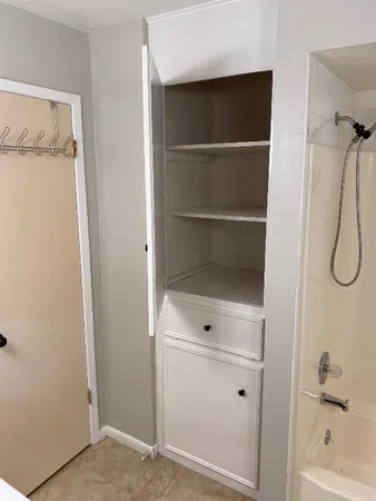 a bathroom with a sink a vanity and mirror