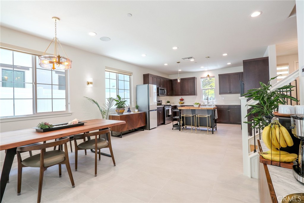 981 Rodeo Road Pomona, CA 91766 - Photo 11 of 47 a kitchen and a dining table in it