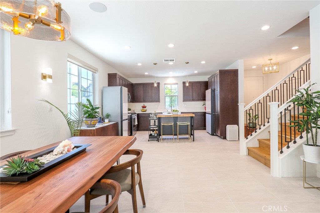 981 Rodeo Road Pomona, CA 91766 - Photo 13 of 47 a kitchen with stainless steel appliances kitchen island granite top and refrigerator