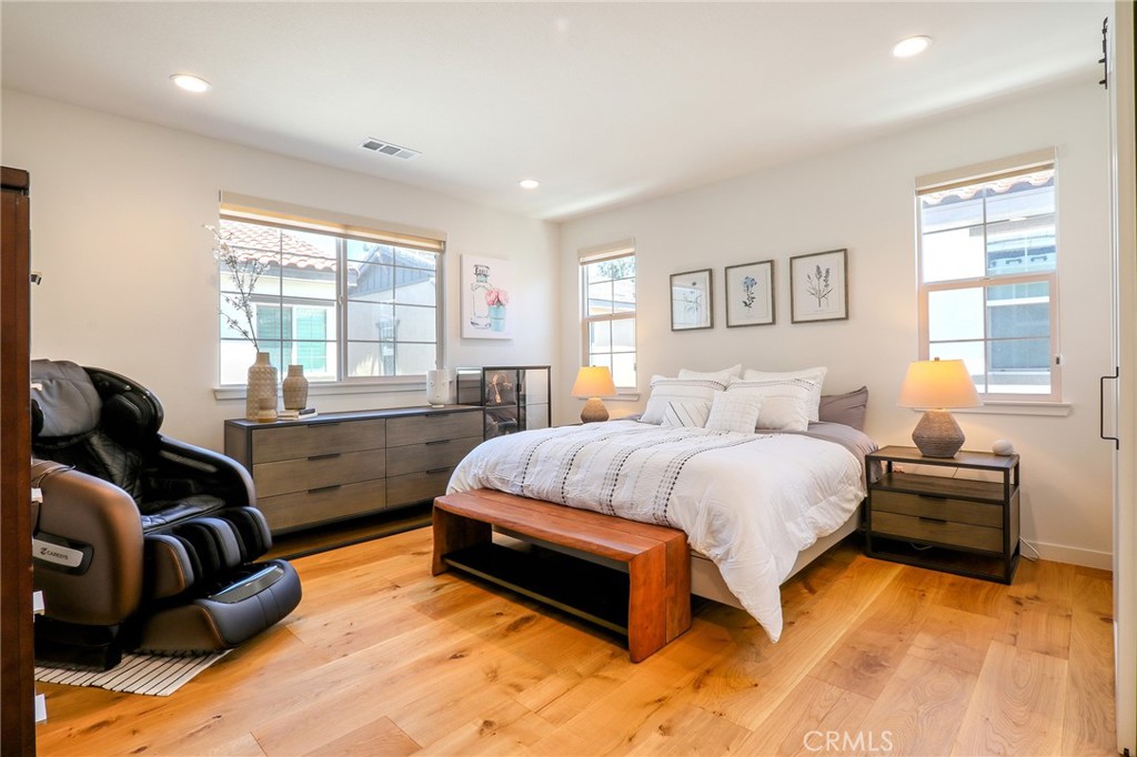 981 Rodeo Road Pomona, CA 91766 - Photo 25 of 47 a spacious bedroom with a bed and a couch