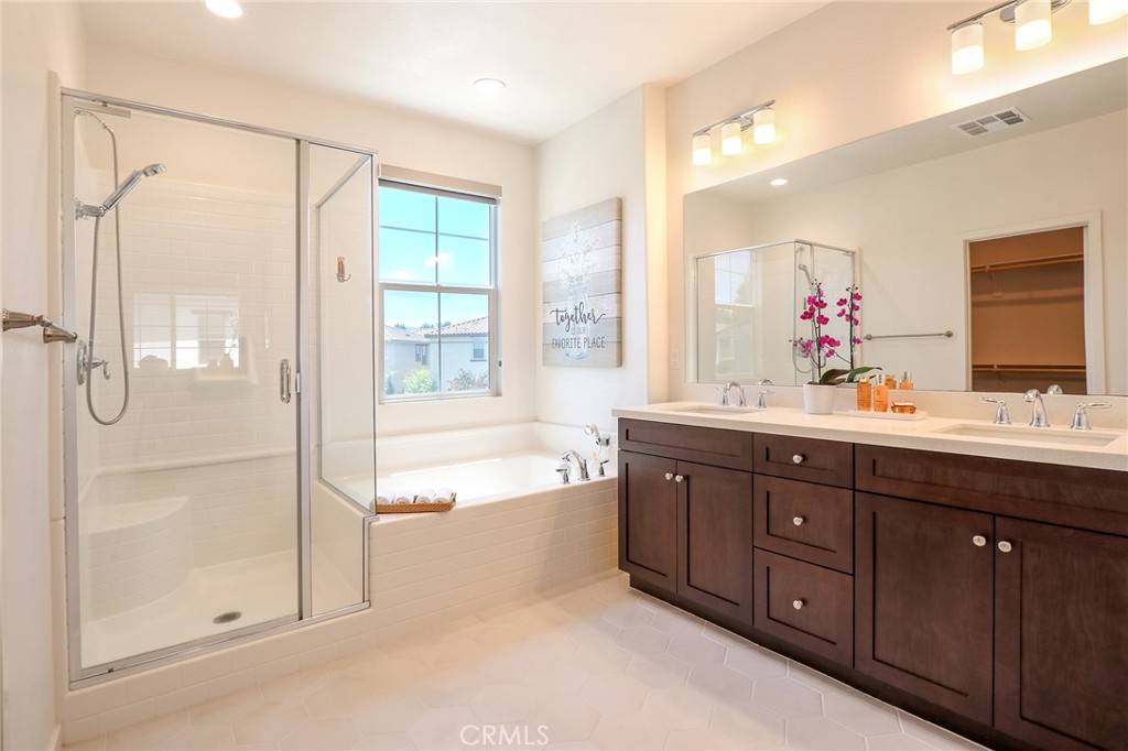 981 Rodeo Road Pomona, CA 91766 - Photo 29 of 47 a spacious bathroom with a tub sink shower and mirror