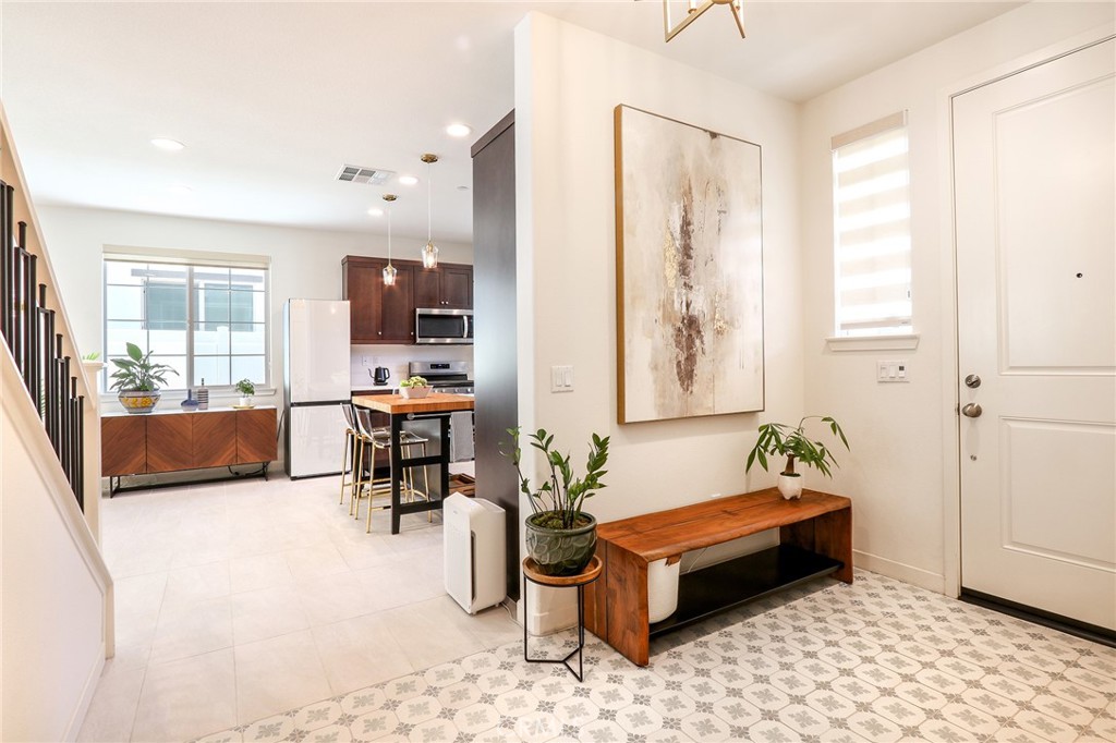 981 Rodeo Road Pomona, CA 91766 - Photo 3 of 47 a living room with furniture and wooden floor