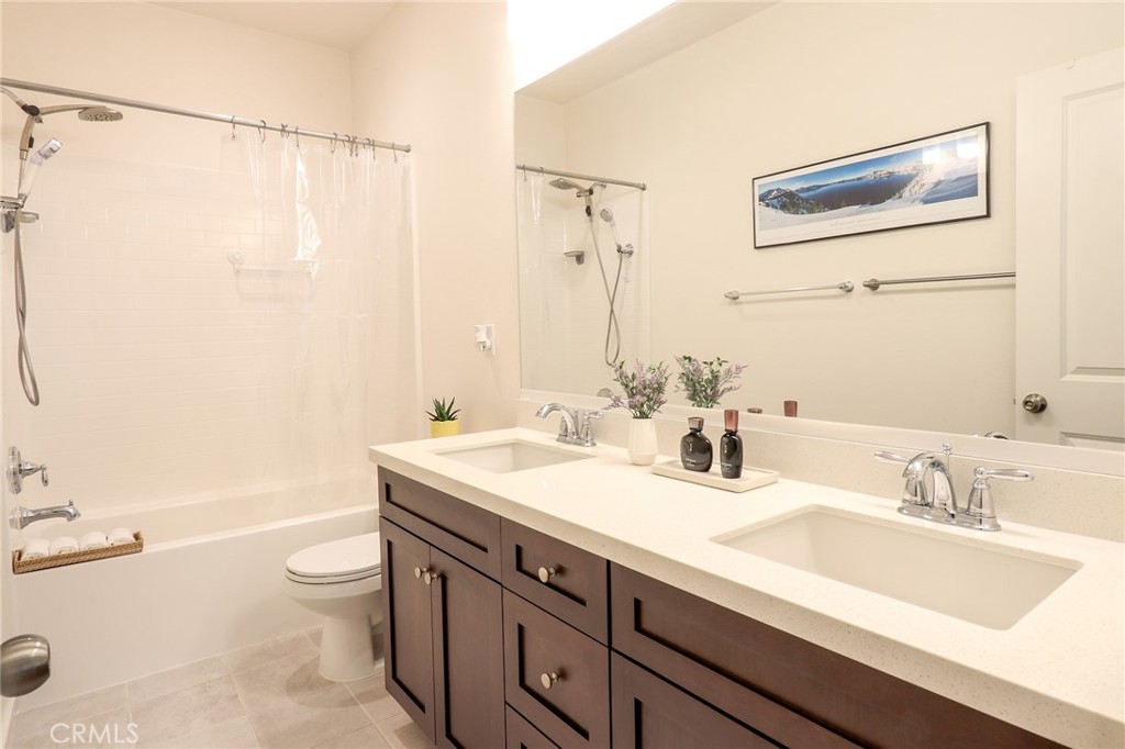 981 Rodeo Road Pomona, CA 91766 - Photo 37 of 47 a bathroom with a sink a toilet and shower