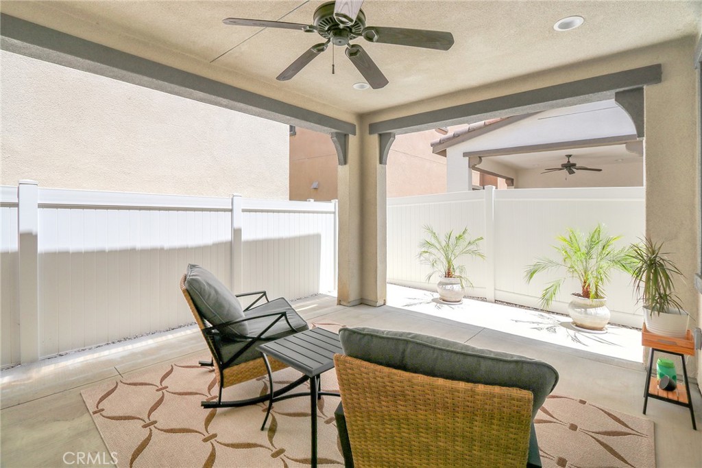 981 Rodeo Road Pomona, CA 91766 - Photo 39 of 47 a living room with a couch and a chandelier