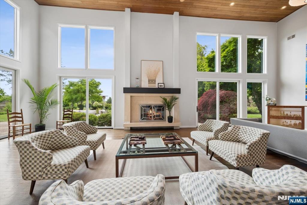 39 Eagle Nest Road Morris Township, NJ 07960 - Photo 10 of 43 a living room with furniture and a fireplace