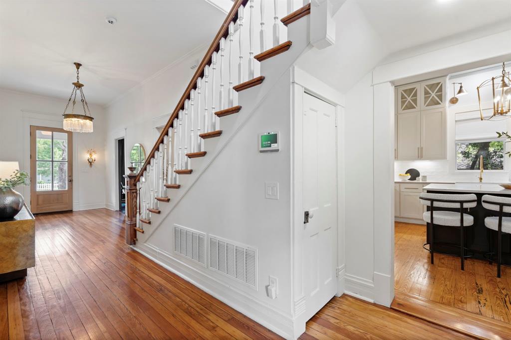 1502 West Virginia Street McKinney, TX 75069 - Photo 23 of 40 a view of entryway with wooden floor and stairs