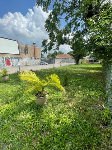 a swimming pool with outdoor seating and yard