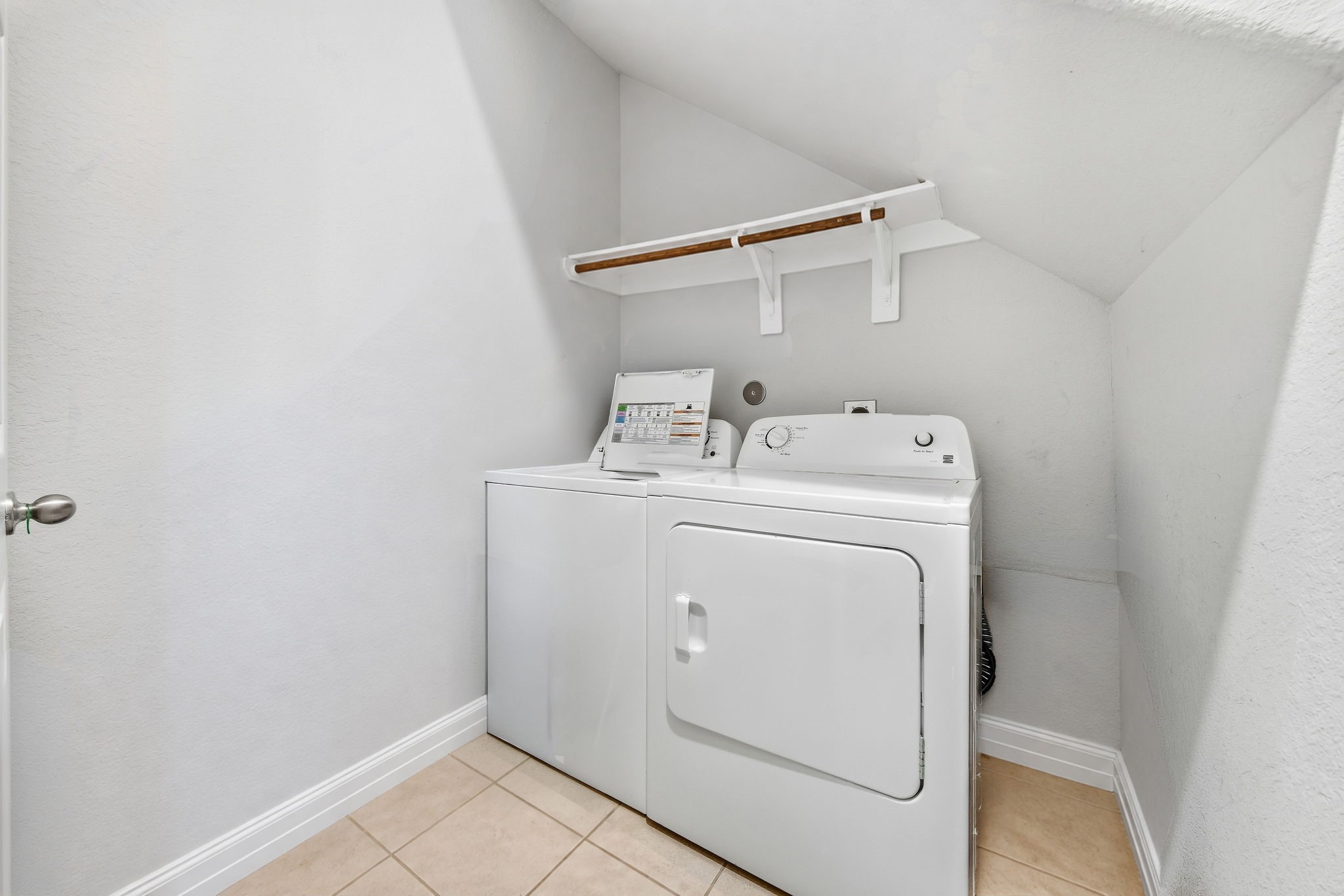 17714 Sugar Magnolia Lane Spring, TX 77379 - Photo 18 of 24 Utility room with built-in shelving, conveniently located inside the home.