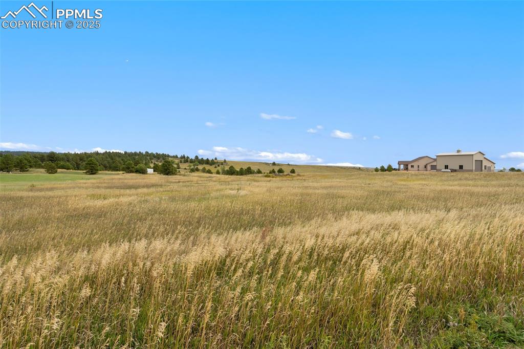 15550 Atlas Loop Peyton, CO 80831 - Photo 12 of 23 a view of an ocean and beach