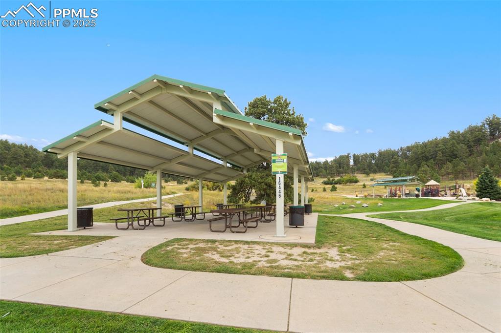 15550 Atlas Loop Peyton, CO 80831 - Photo 22 of 23 a view of a house with a park