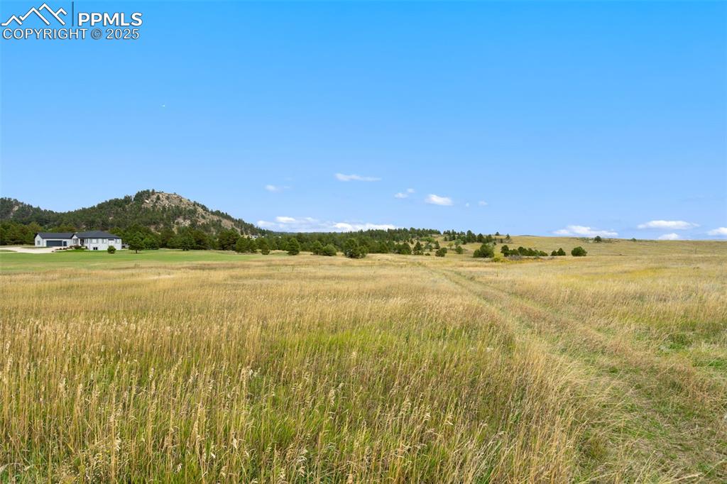 15550 Atlas Loop Peyton, CO 80831 - Photo 9 of 23 a view of an ocean and beach