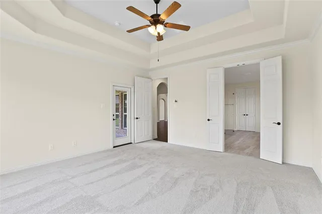 a large white bathroom with a tub sink shower and mirror