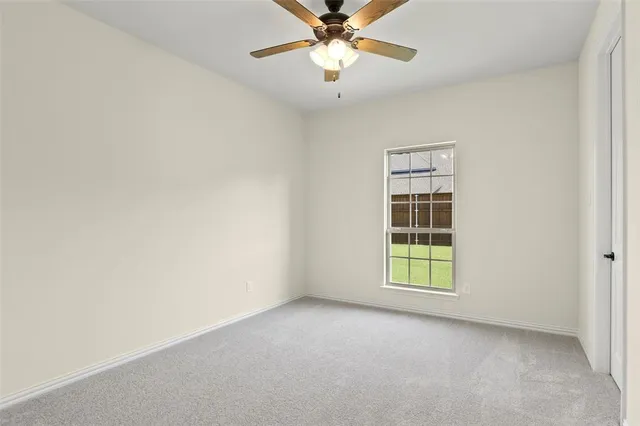 a bedroom with a bed and a potted plant