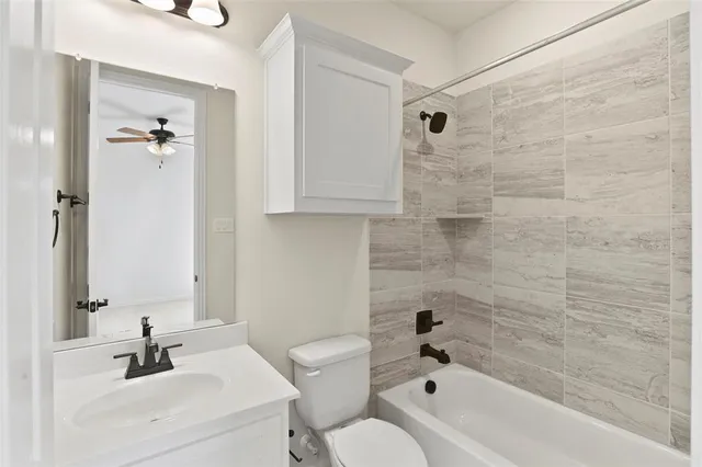 a spacious bedroom with a bed and a large window