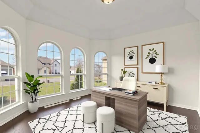 a dining room with furniture and wooden floor