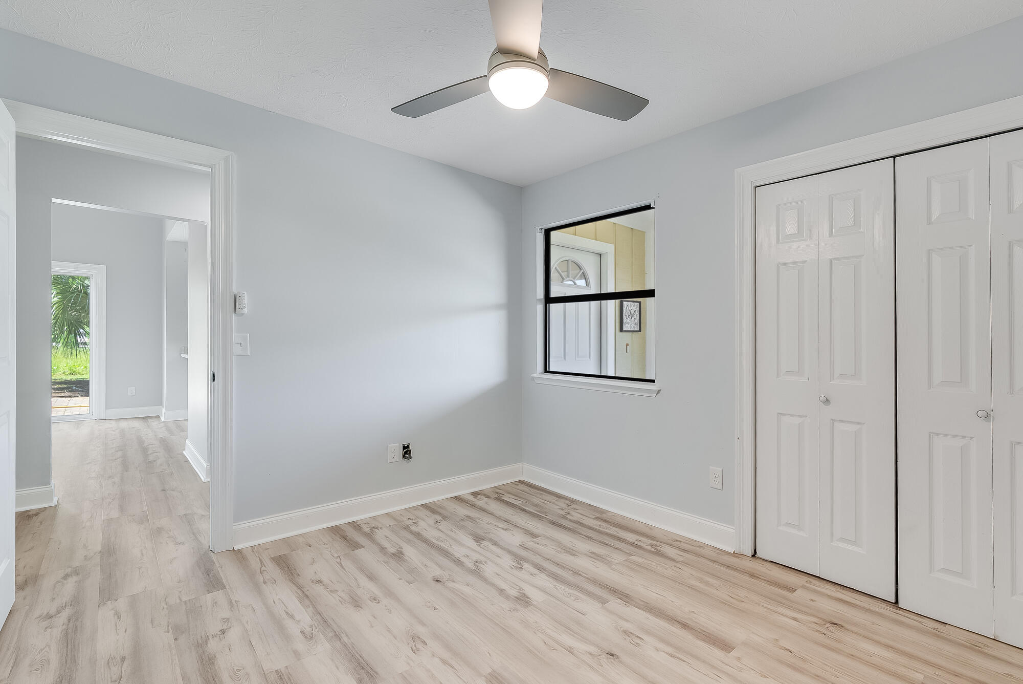 1307 Calabria Road, Unit 4A Panama City, FL 32405 - Photo 27 of 35 wooden floor in an empty room with a window