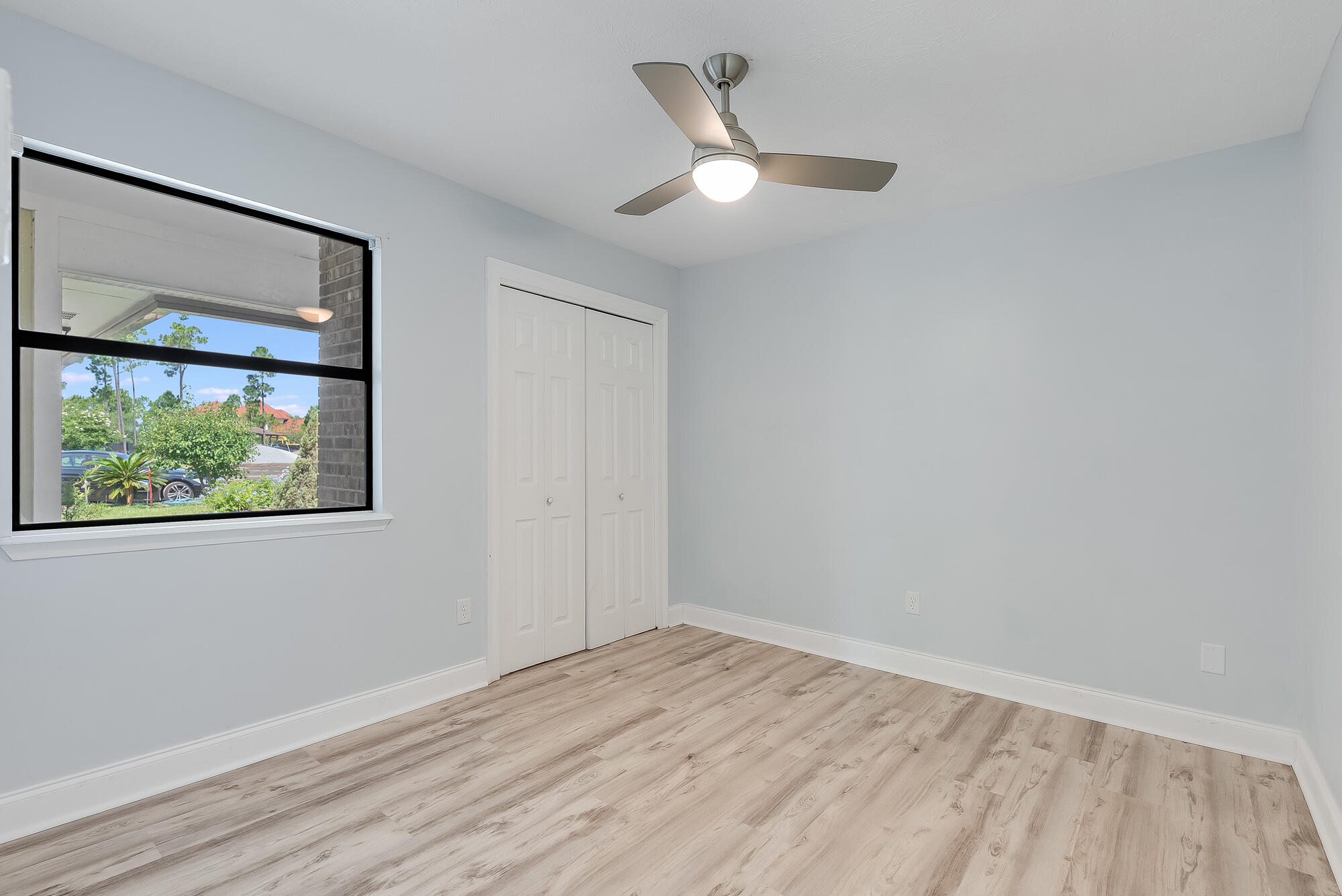 1307 Calabria Road, Unit 4A Panama City, FL 32405 - Photo 28 of 35 wooden floor in an empty room with a window