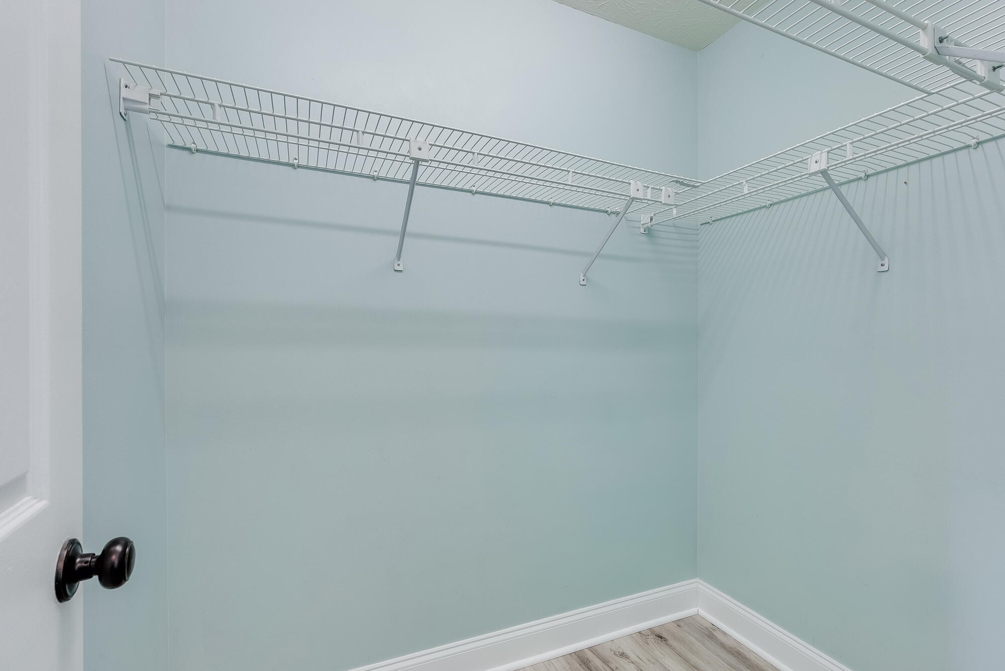 1307 Calabria Road, Unit 4A Panama City, FL 32405 - Photo 30 of 35 a view of a room with racks on the wall