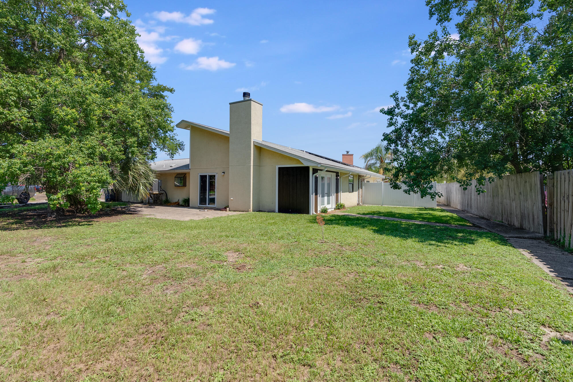 1307 Calabria Road, Unit 4A Panama City, FL 32405 - Photo 33 of 35 a front view of house with yard and green space