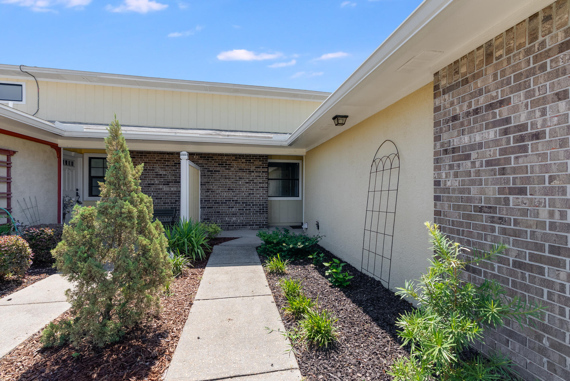 1307 Calabria Road, Unit 4A Panama City, FL 32405 - Photo 6 of 35 a front view of a house with garden