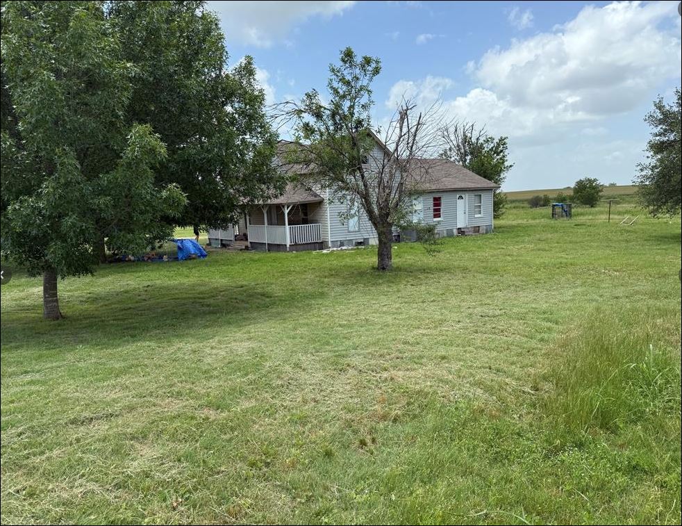 18543 Cyclone Branch Road Burlington, TX 76519 - Photo 12 of 13 a front view of a house with a yard