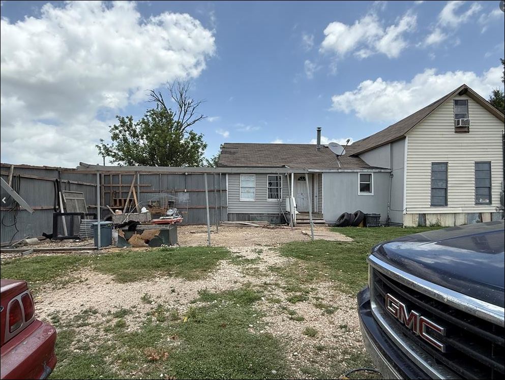 18543 Cyclone Branch Road Burlington, TX 76519 - Photo 3 of 13 a view of a house with backyard and sitting area