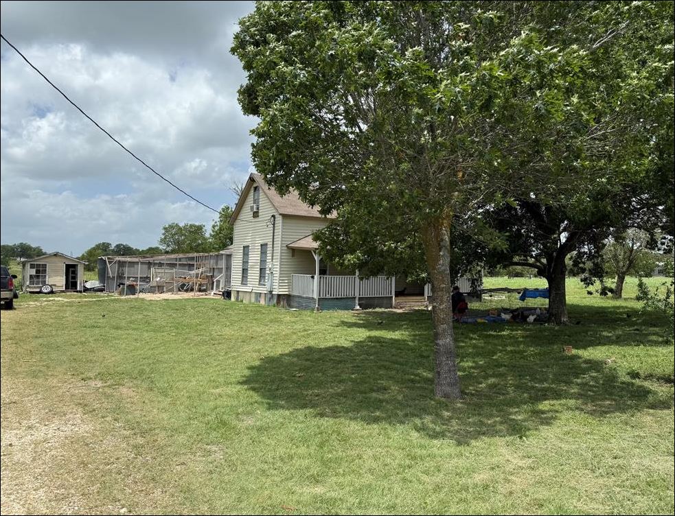 18543 Cyclone Branch Road Burlington, TX 76519 - Photo 8 of 13 a view of a house with a yard