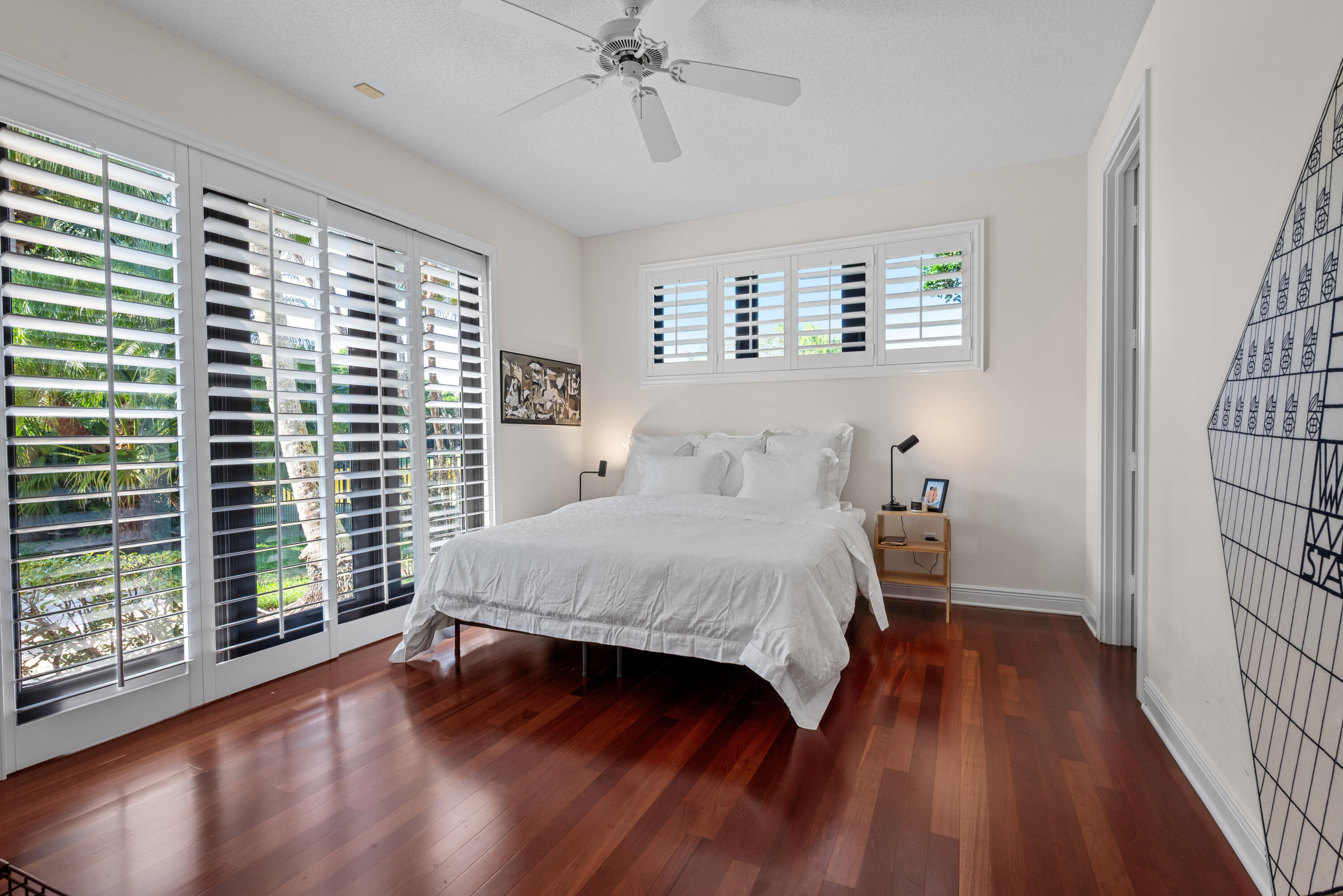 18800 Long Lake Drive Boca Raton, FL 33496 - Photo 56 of 60 a bedroom with a large bed and a window