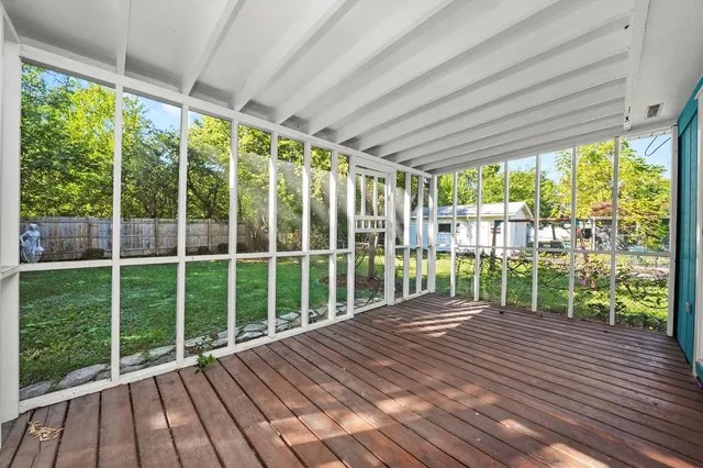 a view of a deck with wooden floor and roof