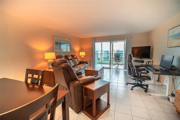 a view of a livingroom with workspace and a couch
