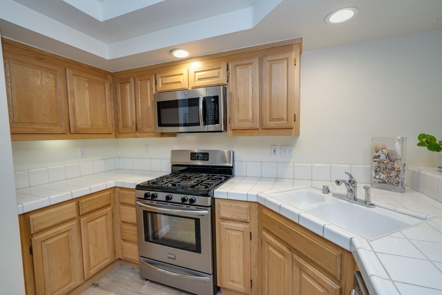 120 Patrick Way Half Moon Bay, CA 94019 - Photo 11 of 23 a kitchen with stainless steel appliances granite countertop a sink stove and microwave