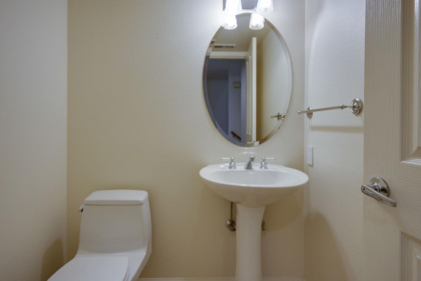 120 Patrick Way Half Moon Bay, CA 94019 - Photo 20 of 23 a bathroom with a toilet sink and mirror