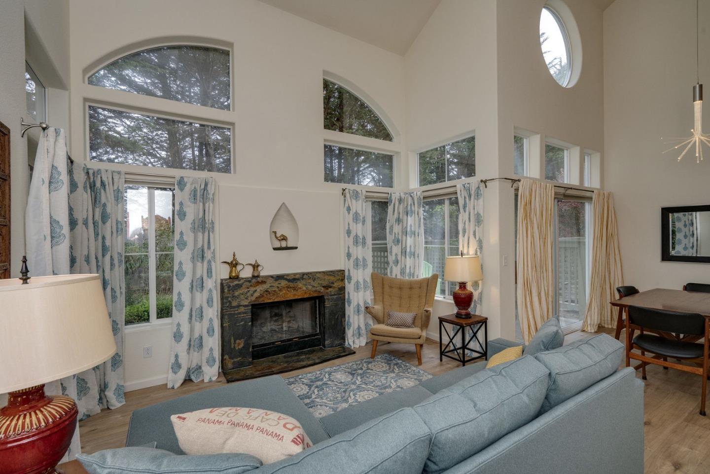 120 Patrick Way Half Moon Bay, CA 94019 - Photo 4 of 23 a living room with furniture a fireplace and a flat screen tv