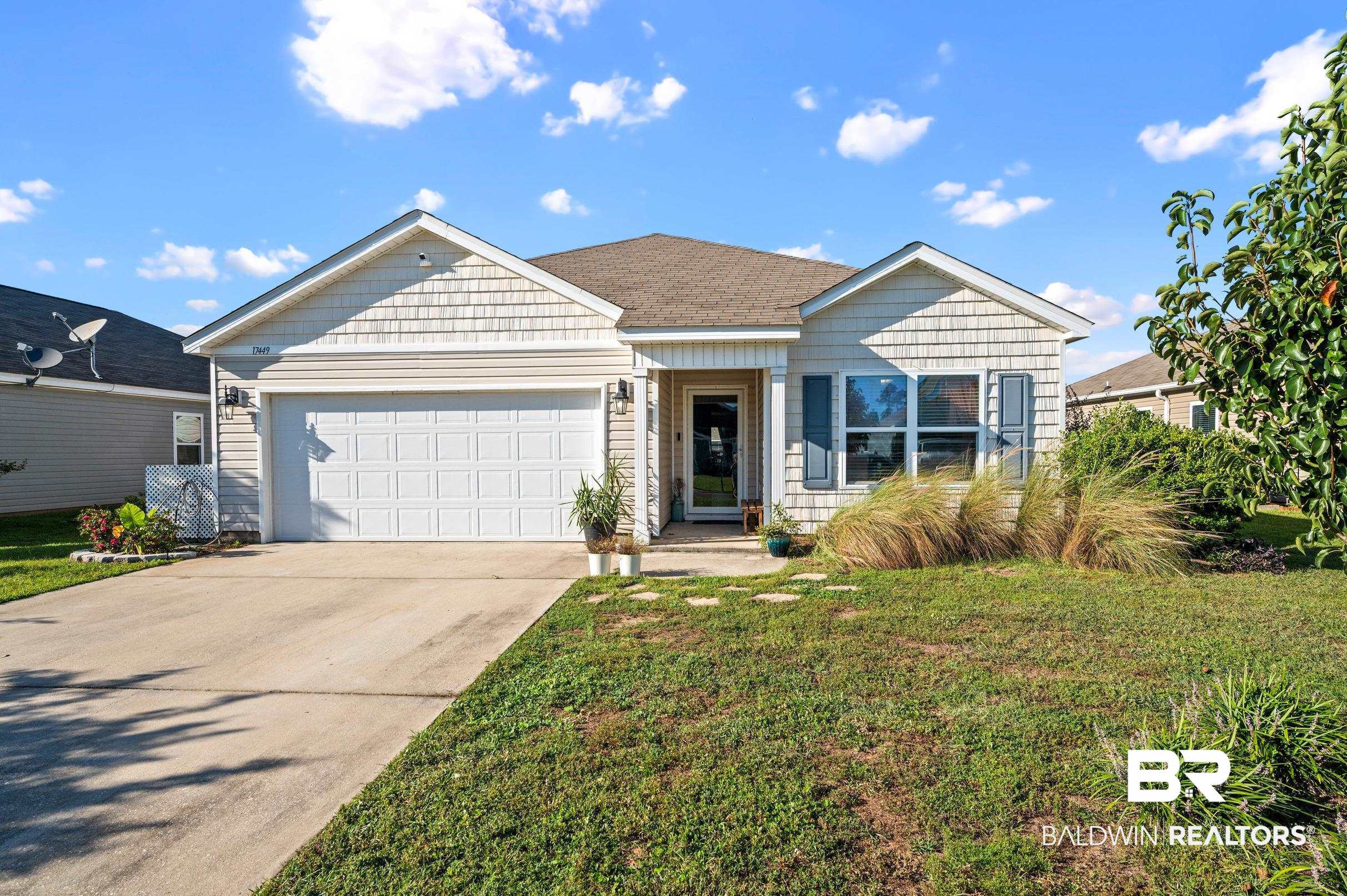 17449 Harding Drive Foley, AL 36535 - Photo 2 of 52 View of front of house featuring a front yard and a garage