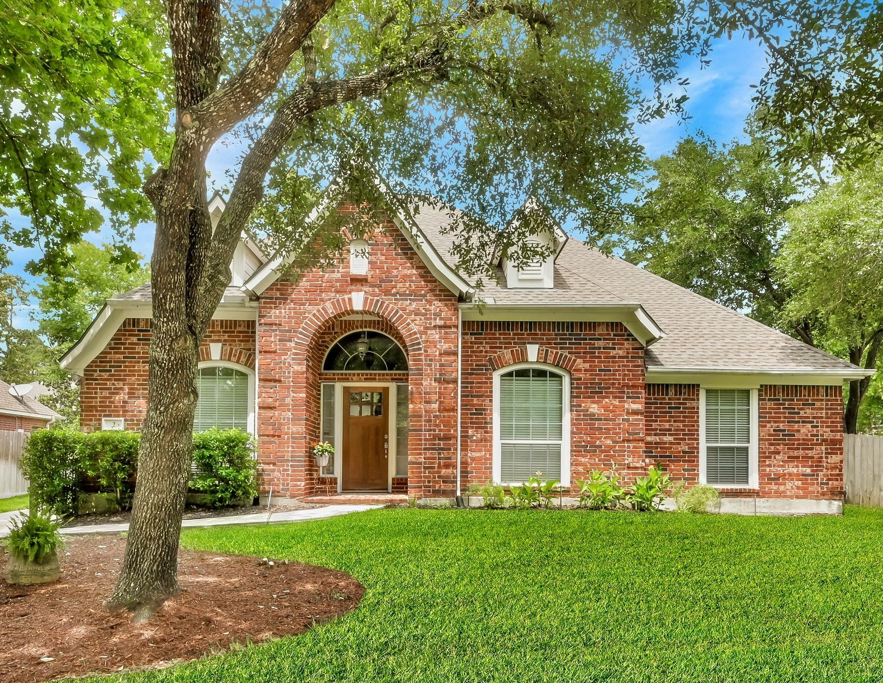2 Westward Ridge Place The Woodlands, TX 77384 - Photo 3 of 43 Welcome to mature trees and easy access to all The Woodlands has to offer!