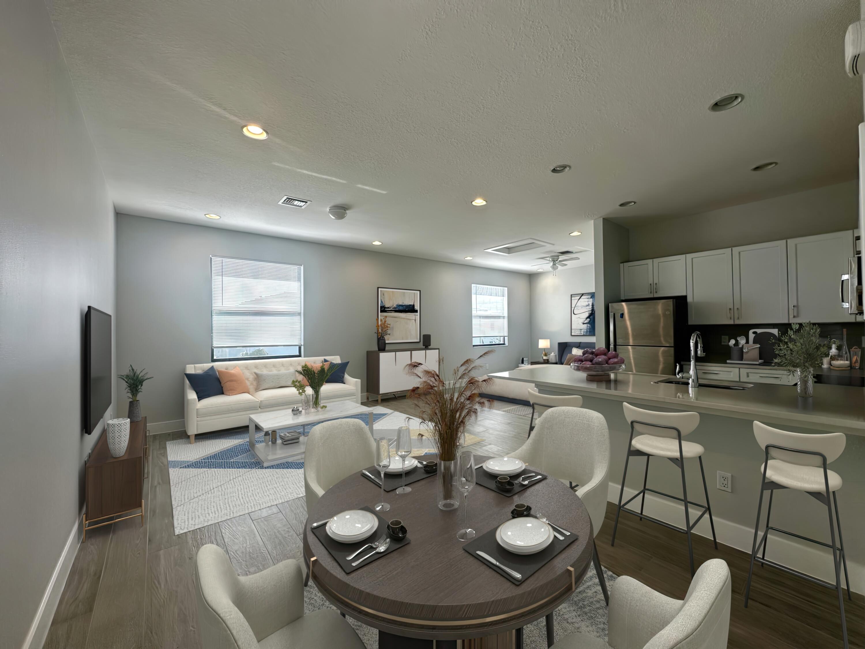 a dining room with furniture a window and kitchen view