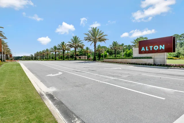 a view of a street with a building in the background