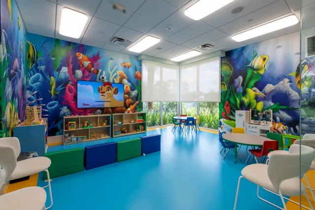 a room with lots of furniture and toys