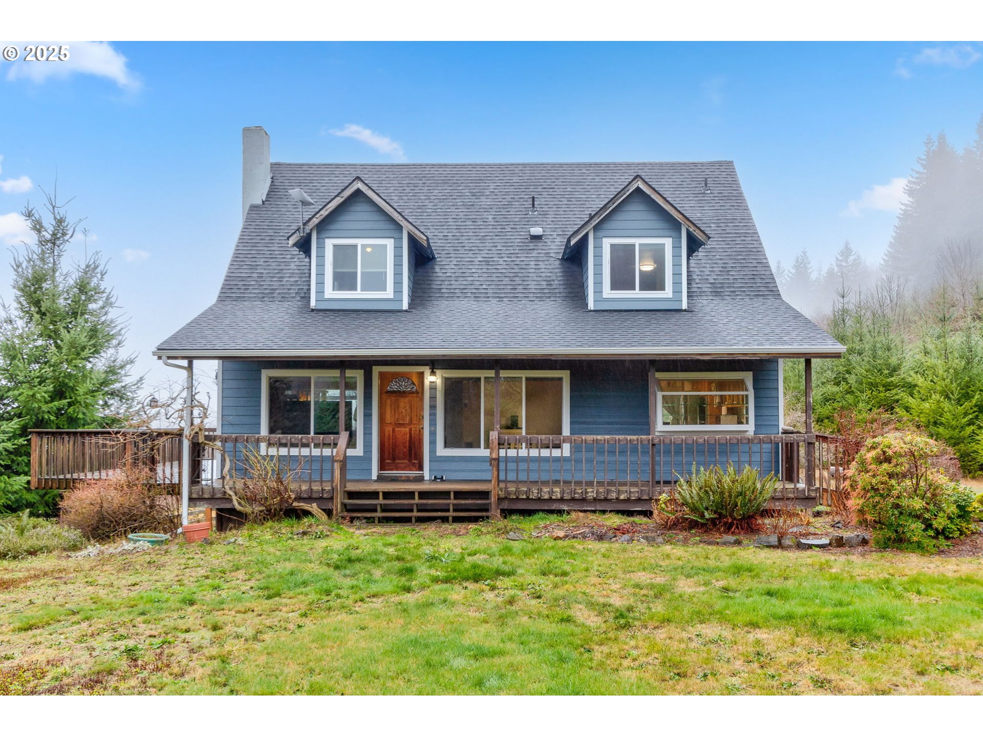 43907 Northeast Columbia Tie Road Amboy, WA 98601 - Photo 1 of 42 a front view of a house with a yard