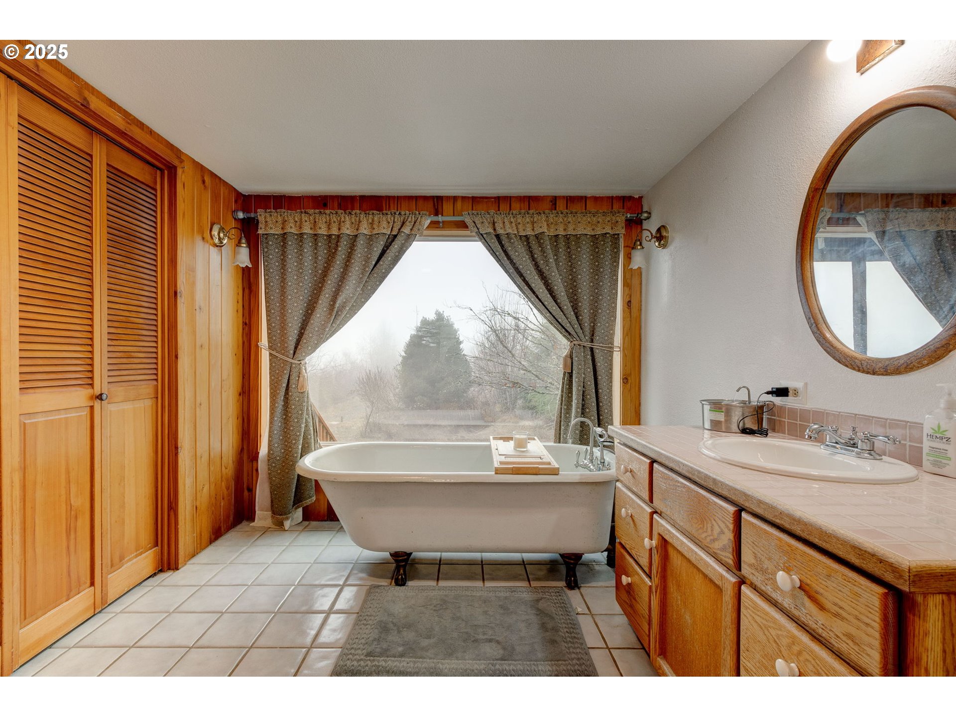 43907 Northeast Columbia Tie Road Amboy, WA 98601 - Photo 17 of 42 a bathroom with a sink mirror and a bathtub