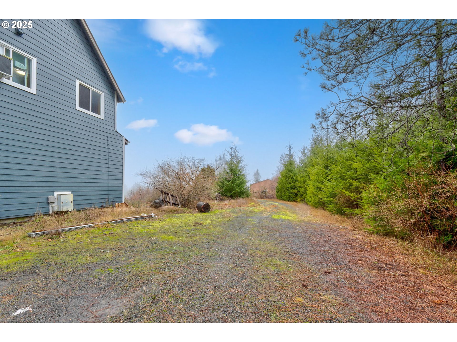 43907 Northeast Columbia Tie Road Amboy, WA 98601 - Photo 26 of 42 a backyard of a house with yard and wooden fence