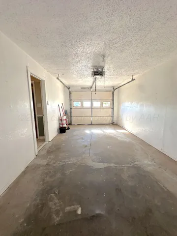 a view of a livingroom with wooden cabinets