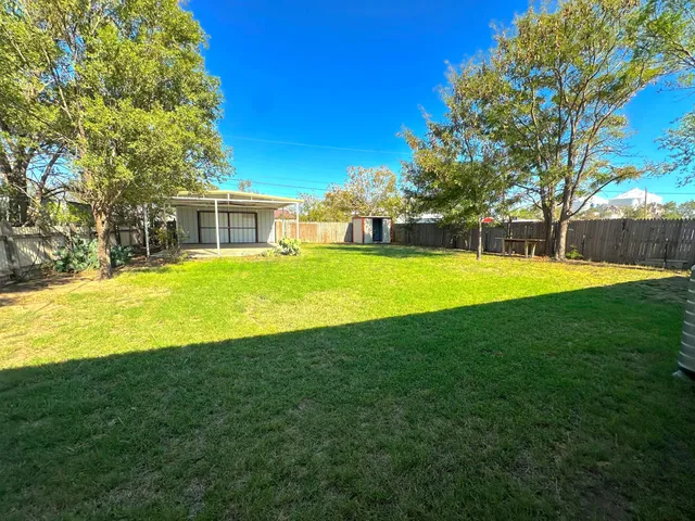 a view of a house with a big yard