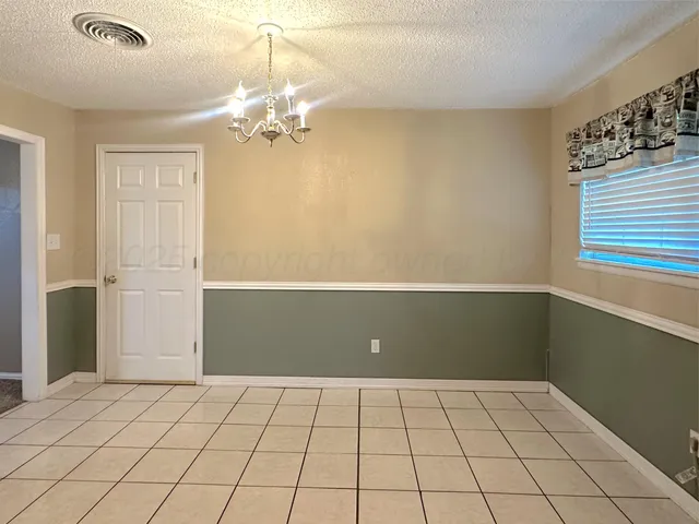 a view of an empty room with window