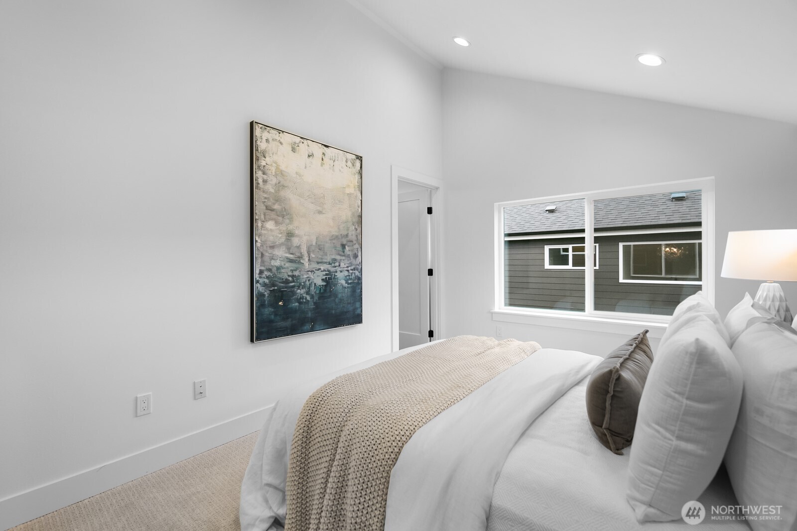 320 North 84th Street Seattle, WA 98103 - Photo 14 of 30 a bedroom with a bed and a window