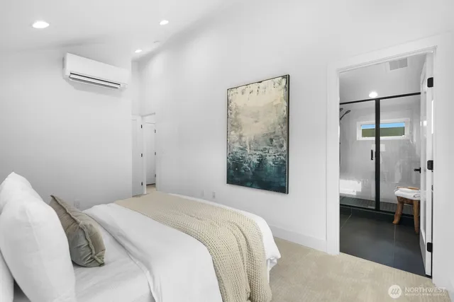 a bedroom with a bed and a view of bathroom