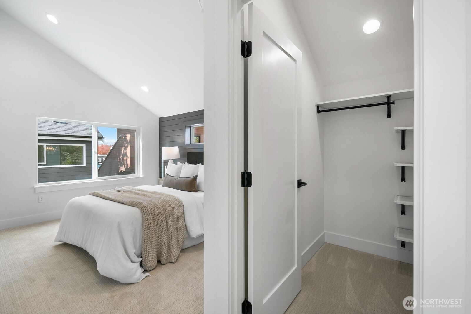 320 North 84th Street Seattle, WA 98103 - Photo 16 of 30 a bedroom with a bed and a window