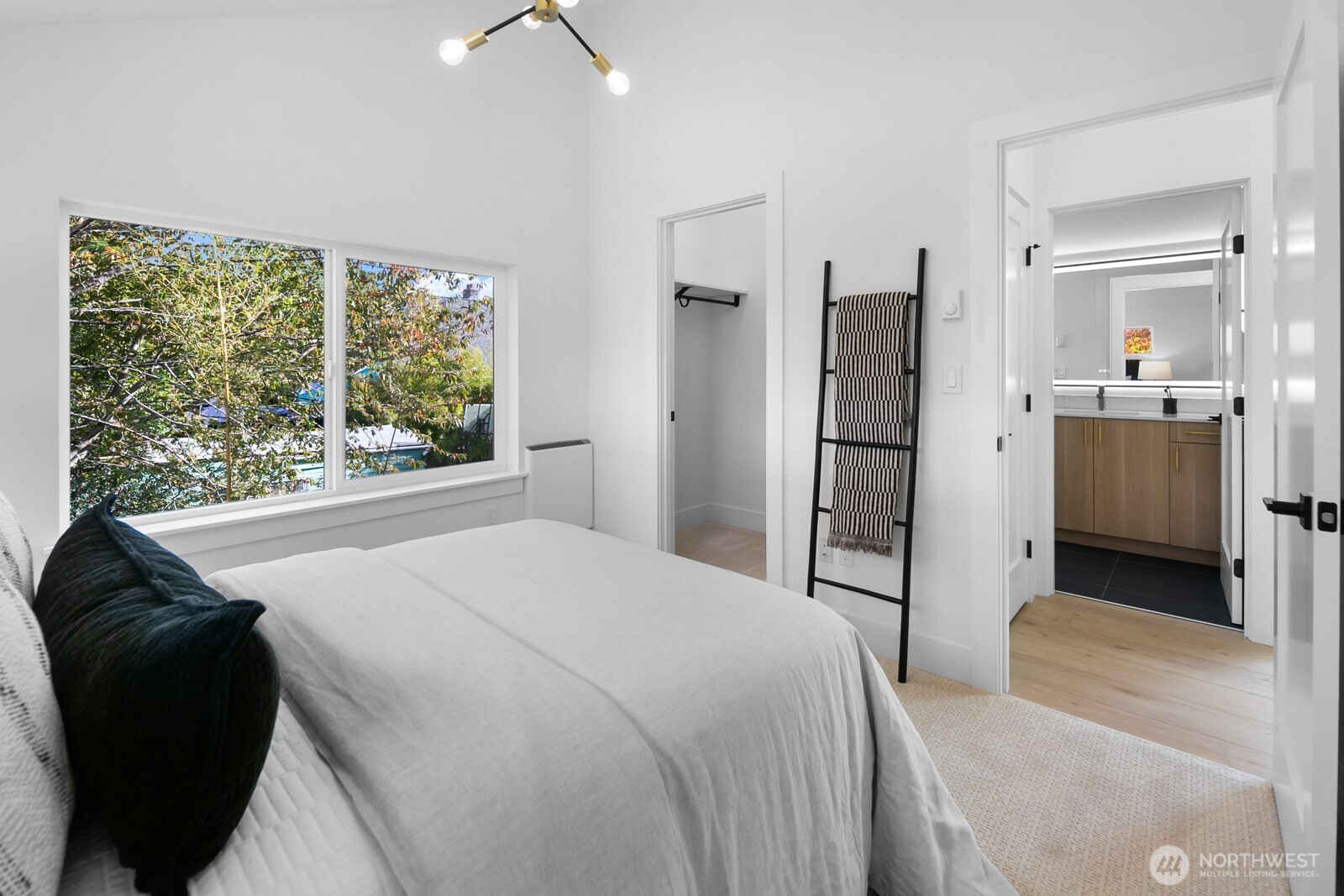 320 North 84th Street Seattle, WA 98103 - Photo 20 of 30 a spacious bedroom with a bed and a large window