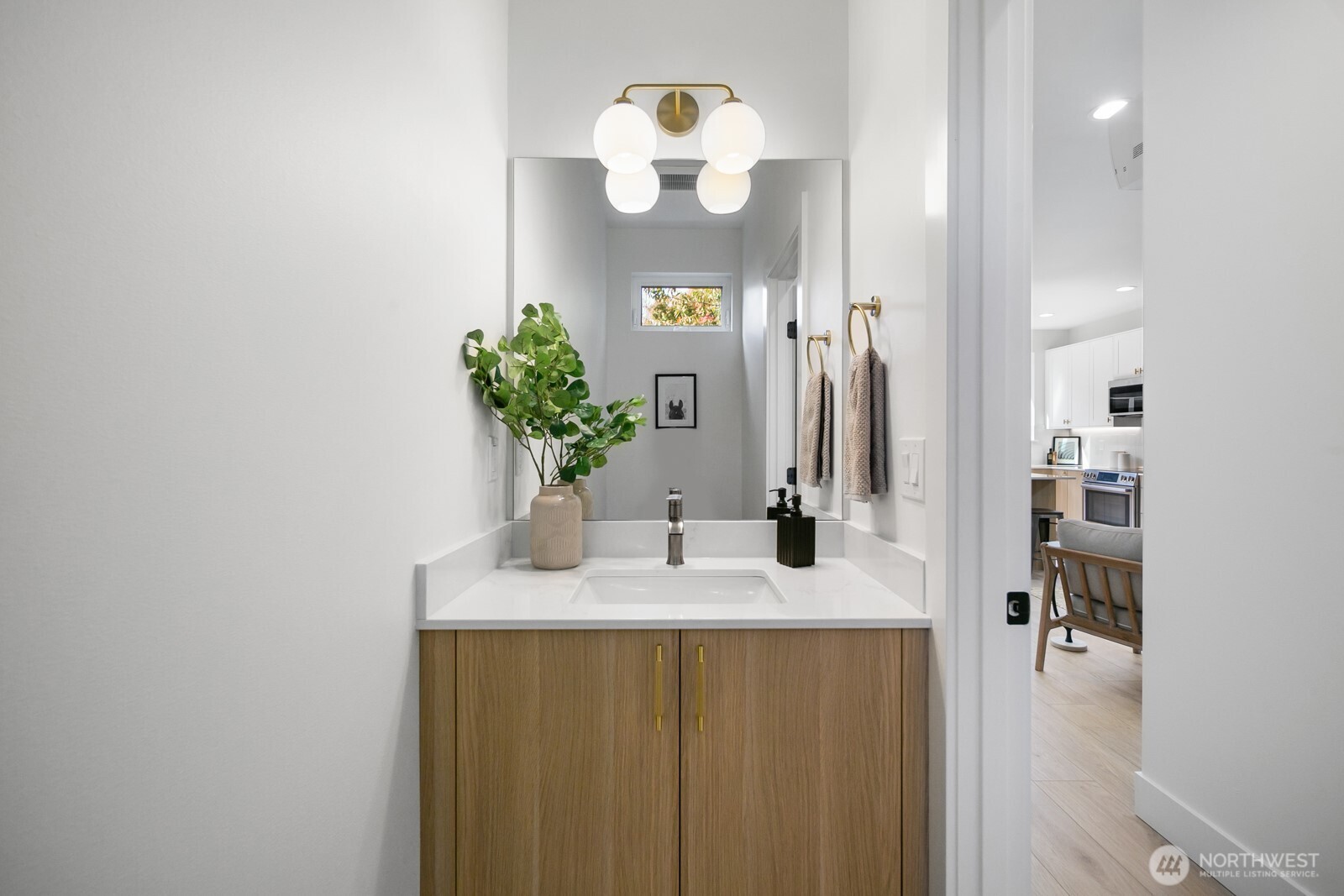 320 North 84th Street Seattle, WA 98103 - Photo 10 of 30 a bathroom with a sink vanity and a mirror